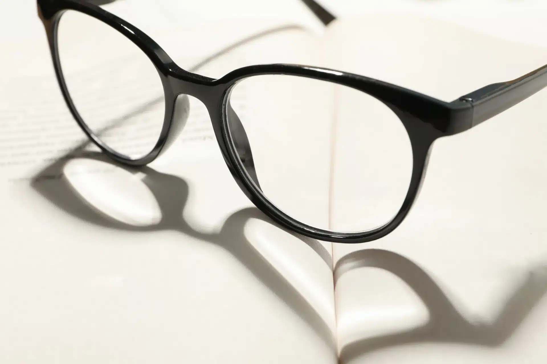 heart-made-of-shadow-and-glasses-on-opened-book-c-2023-11-27-04-51-48-utc